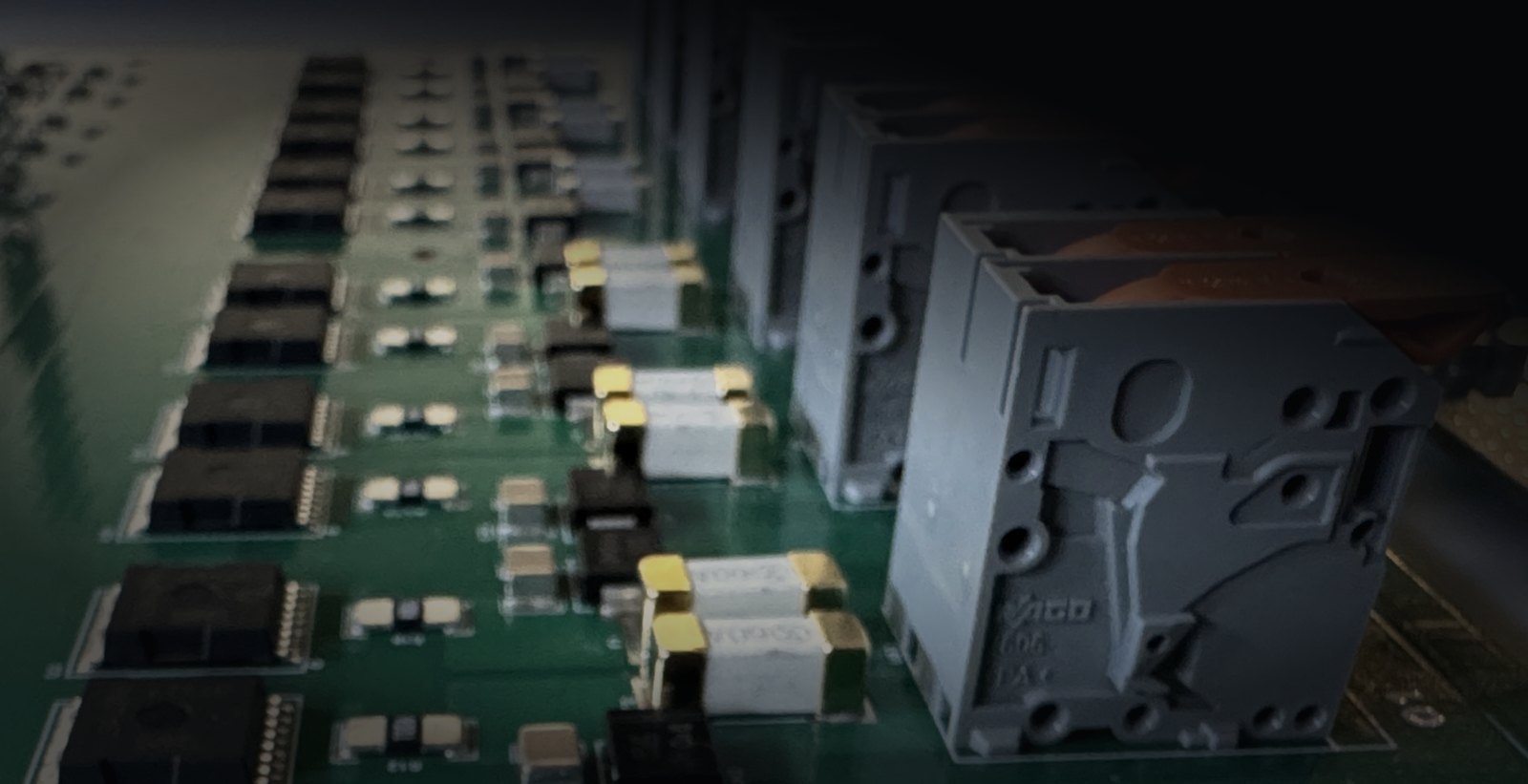 Close-up of the solid-state output channels and lever terminals on the AiBatteryPro power distribution board