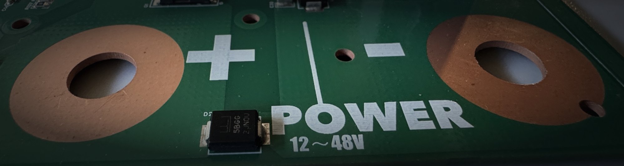 Close-up of the main power terminals, marked POWER 12 to 48 V